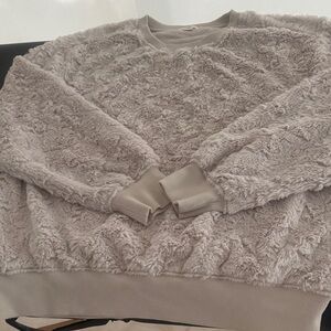 Dylan Soft Textured cream colored fuzzy sweatshirt.